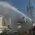 A jet of water being sprayed onto a reactor site