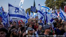 Israelis protest against plans by Prime Minister Benjamin Netanyahu's new government to overhaul the judicial system outside the Knesset, Israel's parliament in Jerusalem, Monday, Feb. 20, 2023. Israel's government is pressing ahead with its contentious plan to overhaul the country's legal system. A vote in parliament on Monday is due despite an unprecedented uproar that has included mass demonstrations, warnings from military and business leaders and calls for restraint from the U.S. (AP Photo/Ohad Zwigenberg)