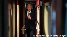 US President Joe Biden walks down a train corridor to his cabin after a surprise visit with Ukrainian President Volodymyr Zelenskyy, in Kyiv on February 20, 2023. - Biden took a nearly 10-hour train ride from Poland into Kyiv. (Photo by Evan Vucci / POOL / AFP) (Photo by EVAN VUCCI/POOL/AFP via Getty Images)
