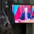 Трансляція виступу Путіна 24 лютого 2022 та російський солдат поруч з екраном