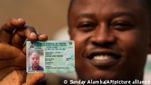 11/01/2023 A youth shows his elections permanent voters card moment after picking it up from the electoral officials at a distribution centre, ahead of Feb. 2023 Presidential elections in Lagos, Nigeria, Wednesday, Jan. 11, 2023. Fueled by high unemployment and growing insecurity, younger Nigerians are mobilizing in record numbers to take part in this month's presidential election. (AP Photo/Sunday Alamba)