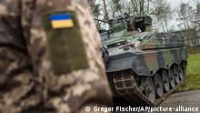 20.2.2023***Munster***
A Ukrainian soldier is standing in front of a Marder infantry fighting vehicle at the German forces Bundeswehr training area in Munster, Germany, Monday, Feb. 20, 2023. (AP Photo/Gregor Fischer)