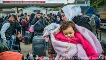 February 21, 2023, Cilvegozu, Hatay, Turkey: A syrian woman holds her baby in a queue in Cilvegozu, a turkish border with Syria. Many syrians are returning to home after the violent earthquake in Turkey made their conditions harder. (Credit Image: Â© Celestino Arce Lavin/ZUMA Press Wire