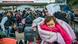 A syrian woman holds her baby in a queue in Cilvegozu, a turkish border with Syria. A syrian woman holds her baby in a queue in Cilvegozu, a turkish border with Syria.
