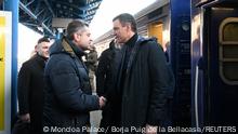 Spain's Prime Minister Pedro Sanchez is greeted by Ukrainian official as he arrives in Ukraine for a visit with Ukraine's President Volodymyr Zelenskiy in Kyiv, Ukraine February 23, 2023. Moncloa Palace/ Borja Puig de la Bellacasa/Handout via REUTERS. THIS IMAGE HAS BEEN SUPPLIED BY A THIRD PARTY. MANDATORY CREDIT.