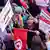 Tunisian protesters chant slogans during a demonstration called by the General Union of Tunisian Workers (UGTT)