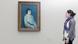 Picture of a woman looking at a painting by Spanish artist Pablo Picasso. Picture of a woman looking at a painting by Spanish artist Pablo Picasso.