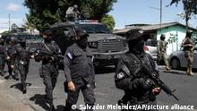 Police arrive in Soyapango, El Salvador, Saturday, Dec. 3, 2022. The government of El Salvador sent 10,000 soldiers and police to seal off Soyapango, on the outskirts of the nation's capital Saturday to search for gang members. (AP Photo/Salvador Melendez)
