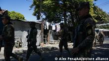 SAN SALVADOR , EL SALVADOR - DECEMBER 27: Members of the Salvadoran army patrol streets and homes during an Anti-Gang Operation in the Tutunichapa community, in the urban area of the capital, in San Salvador, El Salvador, on December 27, 2022. The Salvadoran government ordered as part of its security policy of the Territorial Control Plan the closure of communities in Soyapango and the urban area of the capital, as phase five of the policy. So far, more than 9,500 police and military officers occupy the most densely populated city in the country with operations and checkpoints that have left dozens of gang members captured, according to the president, Nayib Bukele. Alex Pena / Anadolu Agency