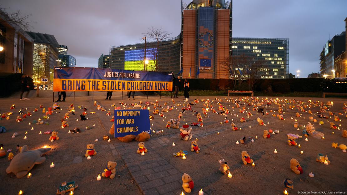 Ukrainians gathered in front of EU Commission building, on the first anniversary of the war, lay candles and toys for the children who lost their lives in Ukraine during the commemorate ceremony at Schuman Square in Brussels, Belgium on February 23, 2023. 
