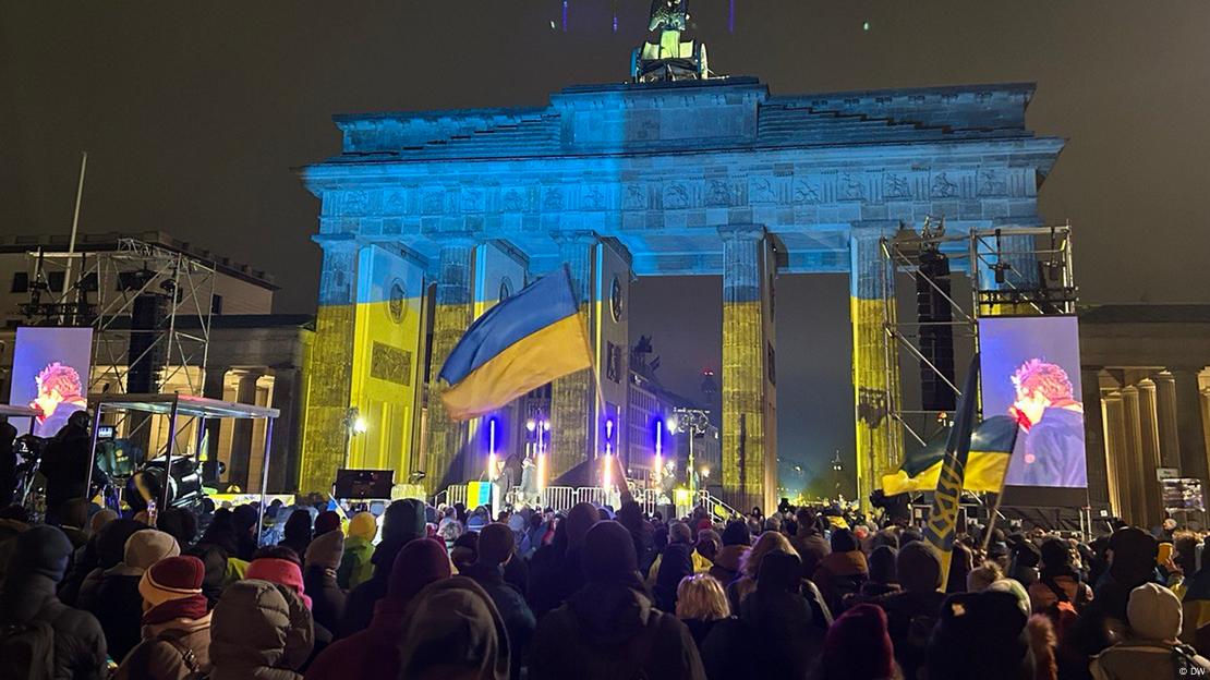 Protesters gathered outside Berlin's Brandenburg Gate, with the landmark lit up in the yellow and blue colors of the Ukrainian flag. 24.02.2023. Rally dedicated to the first anniversary of war and organized by Ukrainian civil movement in Berlin “Vitsche”.