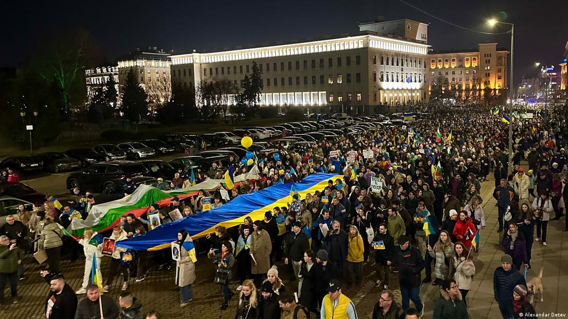 A large group of demonstrators, carrying giant Ukrainian and Bulgarian flags, walking through central Sofia in Bulgaria, February 24, 2023. 