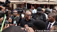 Labour Party presidential candidate Peter Obi (C) talks to the media at outside a polling station in Amatutu on February 25, 2023, before polls open during Nigeria's presidential and general election. (Photo by Patrick Meinhardt / AFP)