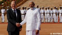 German Chancellor Olaf Scholz shakes hands with Indian Prime Minister Narendra Modi during his ceremonial reception at the forecourt of India's Rashtrapati Bhavan Presidential Palace in New Delhi, India, February 25, 2023. REUTERS/Adnan Abidi
