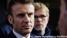 France's President Emmanuel Macron, flanked by France's Agriculture Minister Marc Fesneau, listens to a breeder, on the inauguration day of the 59th edition of the Agriculture fair in Paris, France February 25, 2023. Ludovic Marin/Pool via REUTERS
