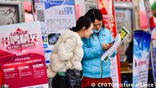 QINGZHOU, CHINA - FEBRUARY 24, 2023 - Job seekers ask for employment information at a job market in Qingzhou, East China's Shandong province, Feb. 24, 2023.