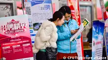 QINGZHOU, CHINA - FEBRUARY 24, 2023 - Job seekers ask for employment information at a job market in Qingzhou, East China's Shandong province, Feb. 24, 2023.