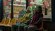 Film still from Everything Everywhere All At Once: two women sitting outside a laundromat. Film still from Everything Everywhere All At Once: two women sitting outside a laundromat.