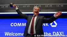 27/02/2023 Manfred Knof, Chairman of the Board of Managing Directors Commerzbank rings the opening bell on the first trading as Commerzbank rejoins the DAX index at the stock exchange in Frankfurt, Germany, February 27, 2023. REUTERS/Kai Pfaffenbach