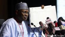 The Chairman of Independent National Electoral Commission, Yakubu Mahmood, displays a results sheet to the media during the presentation of final results of Nigerias 2023 General and Presidential election at the International Conference Centre (ICC), the venue of National Collation Centrein Abuja on February 27, 2023, two days after Nigeria's presidential and general election. (Photo by KOLA SULAIMON / AFP) (Photo by KOLA SULAIMON/AFP via Getty Images)
