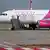 A Wizz Air plane on the tarmac