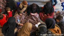 Syrian women recite prayers at an emergency shelter in the center of the city of Maarat Misrin, in the rebel-held northern part of the northwestern Idlib province one day after a deadly earthquake hit Syria and Turkey, on February 7, 2023. - The Syrian Red Crescent today pressed the United States and the European Union to lift sanctions and cough-up aid after a deadly earthquake killed more than 1,600 people across the war-torn country. (Photo by Abdulaziz KETAZ / AFP)