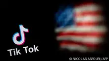 (FILES) This file illustration photo taken on September 14, 2020 shows the logo of the social network application TikTok (L) and a US flag (R) shown on the screens of two laptops in Beijing. - The White House on Monday, February 28, 2023, gave federal agencies 30 days to purge Chinese-owned video-snippet sharing app TikTok from all government-issued devices, setting a deadline to comply with a ban ordered by the US Congress. (Photo by NICOLAS ASFOURI / AFP)