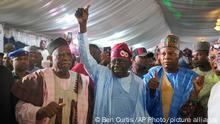 March 1, 2023.**
Bola Tinubu of the All Progressives Congress, center, celebrates with supporters at the party's campaign headquarters after winning the presidential elections in Abuja, Nigeria, Wednesday, March 1, 2023. Election officials declared ruling party candidate Tinubu the winner of Nigeria's presidential election with the two leading opposition candidates already demanding a re-vote in Africa's most populous nation. (AP Photo/Ben Curtis)