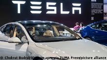 December 5, 2021, Hong Kong, China: A visitor tests and sits in a Tesla model S at the American electric company car Tesla Motors booth during the International Motor Expo (IMXHK) showcasing thermic and electric cars and motorcycles in Hong Kong. (Credit Image: © Chukrut Budrul/SOPA Images via ZUMA Press Wire