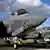 Several Lockheed Martin F-35 combat aircraft sit on a tarmac