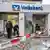 Police investigate damage to a branch of Germany's Volksbank after a cash machine blast there