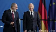 German Chancellor Olaf Scholz, right, and Armenian Prime Minister Nikol Pashinyan, left, arrive for a joint press conference after a meeting at the Chancellery in Berlin, Germany, Thursday, March 2, 2023. (AP Photo/Michael Sohn)