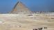 Tourists and the landscape around the Khufu Pyramid, also known as the Great Pyramid of Giza Tourists and the landscape around the Khufu Pyramid, also known as the Great Pyramid of Giza
