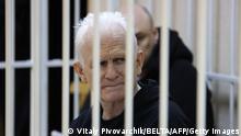 ARCHIV 05.01.2023+++ Nobel Prize winner Ales Bialiatski is seen in the defendants' cage in the courtroom at the start of the hearing in Minsk on January 5, 2023. - Jailed Nobel Prize winner Ales Bialiatski went on trial in Minsk in what supporters see as a bid to clamp down on Viasna, Belarus's top rights group which he founded. - Belarus OUT (Photo by Vitaly PIVOVARCHIK / BELTA / AFP) / Belarus OUT (Photo by VITALY PIVOVARCHIK/BELTA/AFP via Getty Images)