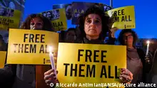 Activists with signs and candles during the sit-in by Amnesty International Italia and Egypt HD for the prisoner of conscience Alaa Abd El Fattah in front of the UK Embassy in Rome, Italy, 8 November 2022. ANSA/RICCARDO ANTIMIANI