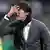 Joachim Löw puts his hand in front of his face in an apparent mixture of anger and exasperation
