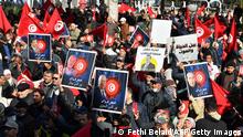 People take part in a demonstration in Tunis on March 5, 2023, in defiance of a protest ban, demanding the release of prominent figures opposed to the president who were arrested in recent weeks. - More than 20 political figures have been arrested in the North African country in recent weeks, including members the main opposition coalition, the National Salvation Front (NSF) and its main component, the Islamist-leaning Ennahdha party. (Photo by FETHI BELAID / AFP) (Photo by FETHI BELAID/AFP via Getty Images)