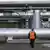 A man standing in front of gas pipelines