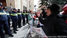 A demonstrator gestures in front of police officers during a protest against the controversial foreign agents bill outside the parliament building in Tbilisi, Georgia March 6, 2023. REUTERS/Irakli Gedenidze