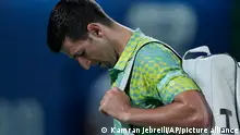 Serbia's Novak Djokovic reacts after he lost their semi final match against Daniil Medvedev at the Dubai Duty Free Tennis Championships in Dubai, United Arab Emirates, Friday, March 2, 2023. (AP Photo/Kamran Jebreili)