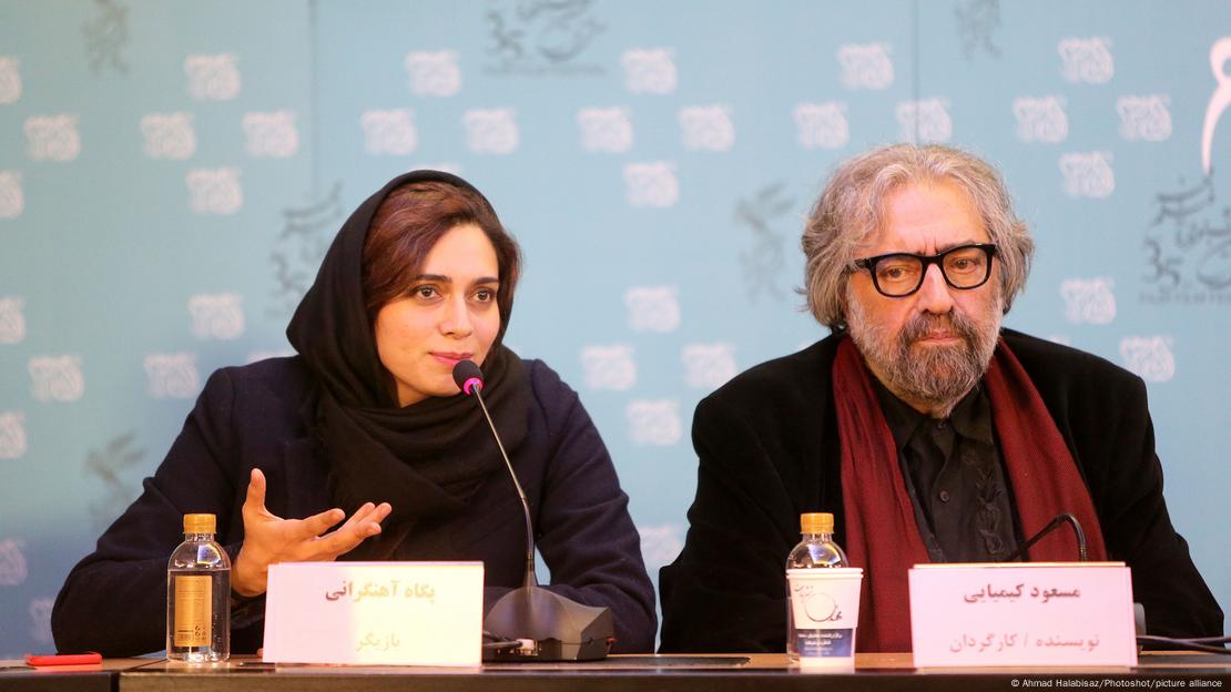 Pegah Ahangarani and director Masoud Kimiaei at a press conference sitting at a table in 2017.