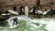 A surfer rides the artificial wave known as the Eisbachwelle in Munich, while other surfers wearing wetsuits wait their turn on the river bank. A surfer rides the artificial wave known as the Eisbachwelle in Munich, while other surfers wearing wetsuits wait their turn on the river bank.