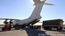 9.2.2023***In this photo released by the official Syrian state news agency SANA, workers unload humanitarian aid sent from Arminia, for Syria following a devastating earthquake, at the airport in Aleppo, Syria, Thursday, Feb. 9, 2023. Rescuers pulled more survivors from beneath the rubble of collapsed buildings Thursday, but hopes were starting to fade of finding many more people alive more than three days after a catastrophic earthquake and series of aftershocks hit Turkey and Syria. (SANA via AP)