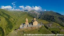 Panorama of Gergeti Trinity Church, Stepantsminda (Kazbegi), Georgia, Caucasus mountains