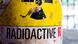 Sebuah stiker berwarna kuning bertuliskan "Radioactive" Sebuah stiker berwarna kuning bertuliskan "Radioactive"