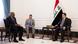 US Defense Secretary Lloyd Austin (l) meets with Iraqi Prime Minister Mohammed Shia al-Sudani (r) in Baghdad as a translator sitting between them takes notes US Defense Secretary Lloyd Austin (l) meets with Iraqi Prime Minister Mohammed Shia al-Sudani (r) in Baghdad as a translator sitting between them takes notes