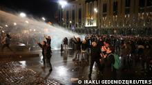 Police use a water cannon to disperse protesters during a rally against the foreign agents law near the parliament building in Tbilisi, Georgia, March 7, 2023. REUTERS/Irakli Gedenidze