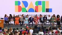 Brazil's President Luiz Inacio Lula da Silva (C) talks to his wife First Lady Rosangela Janja da Silva during an event to celebrate International Women's Day and announce a package of measures to protect and support women, at Planalto Palace in Brasilia on March 8, 2023. - To mark International Women's Day, women across the world are hosting marches, rallies and demonstrations to defend their rights. (Photo by EVARISTO SA / AFP) (Photo by EVARISTO SA/AFP via Getty Images)