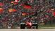 Michael Schumacher im Ferrari 1996 vor einer dicht besetzten Tribüne am Nürburgring Michael Schumacher im Ferrari 1996 vor einer dicht besetzten Tribüne am Nürburgring