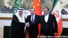 10.3.2023, Peking, China, Wang Yi, a member of the Political Bureau of the Communist Party of China (CPC) Central Committee and director of the Office of the Central Foreign Affairs Commission, Ali Shamkhani, the secretary of Iran’s Supreme National Security Council, and Minister of State and national security adviser of Saudi Arabia Musaad bin Mohammed Al Aiban pose for pictures during a meeting in Beijing, China March 10, 2023. China Daily via REUTERS ATTENTION EDITORS - THIS IMAGE WAS PROVIDED BY A THIRD PARTY. CHINA OUT.